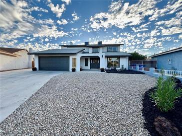 Updated home exterior boasts a two-car garage and modern curb appeal at 3981 Ebro Way, Las Vegas, NV 89103