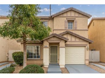 Two-story house with beige exterior, attached garage, and landscaping at 531 Dairy Creek Ave, Las Vegas, NV 89183