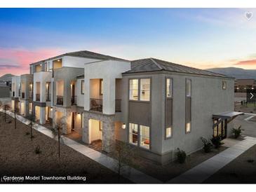 Modern townhome building with contemporary design and attractive landscaping at 6118 Garden Oasis St # Lot 4, Las Vegas, NV 89148