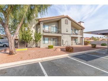 Two-story building exterior with parking and landscaping at 1575 W Warm Springs Rd # 1113, Henderson, NV 89014
