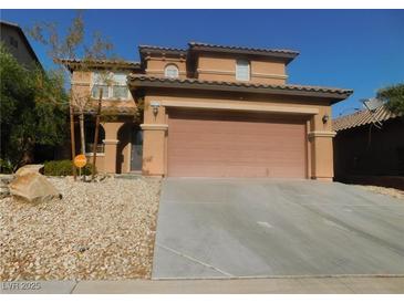 Two story house with attached garage and desert landscaping at 11173 Hickory Glen St, Las Vegas, NV 89179