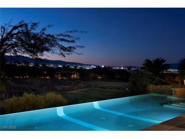 Stunning infinity pool with city views at night at 641 Saint Croix St, Henderson, NV 89012