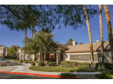 Beautiful building exterior with lush landscaping and clear signage for Carlisle at Summerlin at 10233 King Henry Ave # 203, Las Vegas, NV 89144