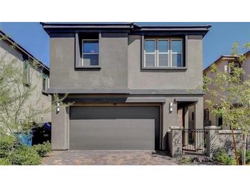 Modern two-story home with attached garage and neutral color scheme at 12525 Lylan Ridge St, Las Vegas, NV 89138