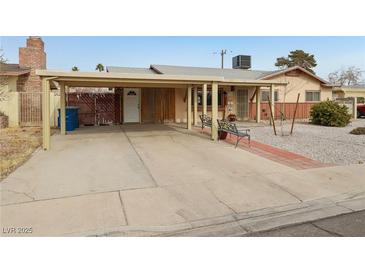 Ranch style home with carport and landscaped yard at 3766 Millwood Ave, Las Vegas, NV 89121