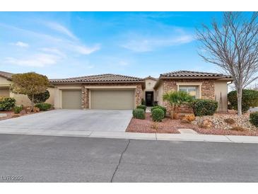 Single-story home with three-car garage, landscaping, and stone accents at 4356 La Romita St # 2, Pahrump, NV 89061