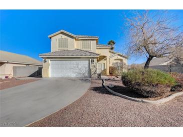 Two-story house with attached garage and landscaped front yard at 2526 Rocky Countryside St, North Las Vegas, NV 89030