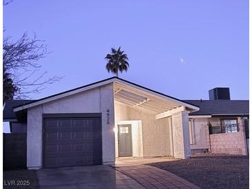 Well-maintained single story home with attached garage and desert landscaping at 4928 Nellie Springs Ct, Las Vegas, NV 89110