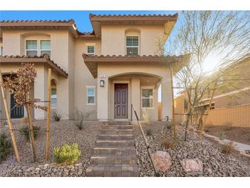 Two-story house with brown roof and desert landscaping at 524 Celebratory Pl, Henderson, NV 89011