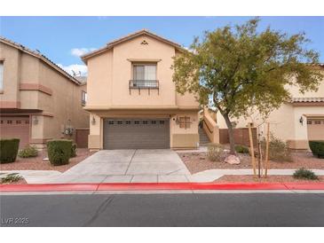 Two-story house with attached garage and landscaped front yard at 5916 Magic Oak St, North Las Vegas, NV 89031