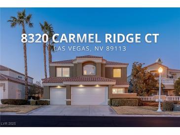 Two-story house with a three-car garage and landscaping at 8320 Carmel Ridge Ct, Las Vegas, NV 89113