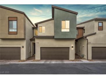 Modern townhouse exterior with attached garage and neutral color palette at 9289 Casa Sierra Ln, Las Vegas, NV 89148