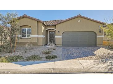 Charming single-story home featuring a two-car garage and low maintenance desert landscaping at 10923 Stone Crossing Ave, Las Vegas, NV 89166