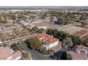 Luxury estate home with circular driveway, nestled in a tranquil, upscale neighborhood at 3495 Pama Ln, Las Vegas, NV 89120