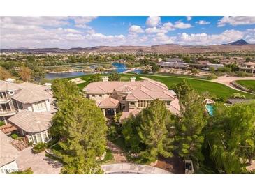 Luxury home on golf course with lake views; expansive property with mature landscaping at 4 Bloomfield Hills Dr, Henderson, NV 89052