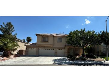 Two-story house with three-car garage and solar panels at 420 Rhythm St, Henderson, NV 89074