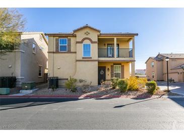 Two-story house with balcony, landscaping, and driveway at 4530 Lime Straight Dr, Las Vegas, NV 89115