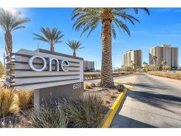 Modern building entrance with palm trees and signage at 8255 Las Vegas Blvd # 1505, Las Vegas, NV 89123