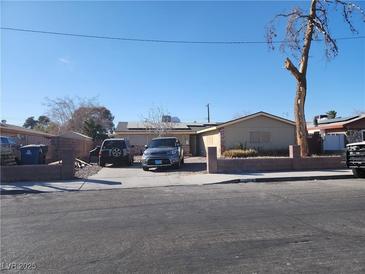 Modest single-story home featuring desert landscaping and a paved driveway for convenient parking at 109 Prince Ln, Las Vegas, NV 89110