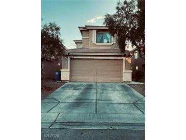 Two-story house with attached garage and driveway at 3495 Greenwood Springs Dr, Las Vegas, NV 89122