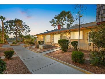 Inviting exterior with landscaped walkway leading to the entrance of the house at 3982 Voxna St, Las Vegas, NV 89119