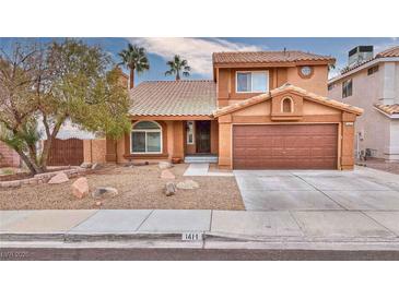 Two-story house with brown garage door and landscaped front yard at 1411 Bareback Ct, Henderson, NV 89014