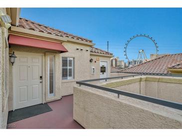 Building exterior with entrance and High Roller view at 220 E Flamingo Rd # 426, Las Vegas, NV 89169