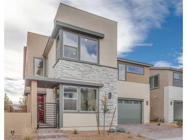 Modern two-story home with stone accents and two-car garage at 1225 Crimson Sunbird St, North Las Vegas, NV 89084