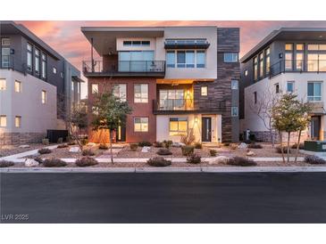 Striking multi-story home with modern design elements and professionally landscaped front yard and balconies at 4269 Solace St # 0, Las Vegas, NV 89135