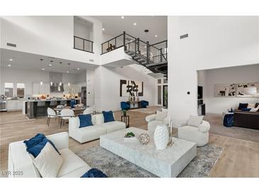 Open floor plan boasts high ceilings, modern fireplace, and ample natural light at 5219 Iron River Ct, Las Vegas, NV 89135