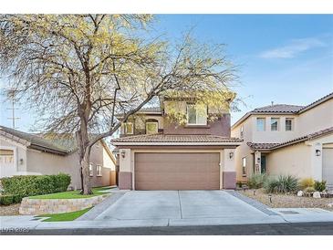 Two-story house with brown accents and a two-car garage at 11157 Sandrone Ave, Las Vegas, NV 89138