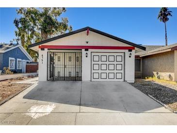 Charming single-story home with a two-car garage and decorative security gate at 4721 Via Renaldo, Las Vegas, NV 89103