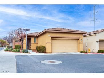 Charming single-story home with a well-maintained front yard on a sunny day at 7611 Redcloud Peak St, Las Vegas, NV 89166