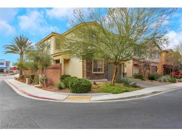 Two-story house with stone accents and a two-car garage at 7747 Harthill Park Ave, Las Vegas, NV 89113