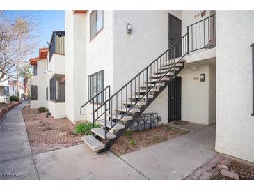 Charming condo complex featuring stairs, secure doors, and well-maintained grounds at 1701 E Katie Ave # 65, Las Vegas, NV 89119