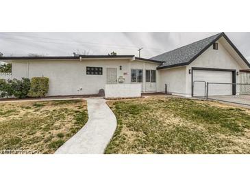 Updated Ranch style home with a landscaped lawn and attached garage at 1947 Balboa Ave, Las Vegas, NV 89169