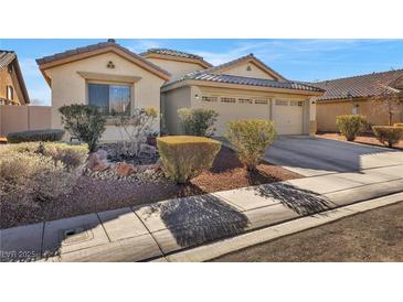 Beautiful desert home with three-car garage and well-manicured landscaping at 3041 Bublin Bay Ave, North Las Vegas, NV 89081