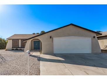 Newly renovated single-story home with a two-car garage and landscaped yard at 4321 Mott Cir, Las Vegas, NV 89102