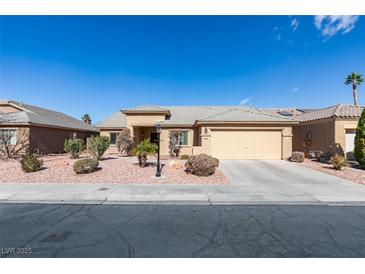 Charming single-story home with well-manicured landscaping and a two-car garage at 5582 Little Lake Ave, Las Vegas, NV 89122