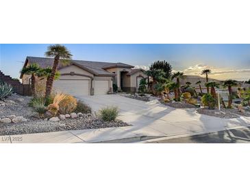 Single-story house with a three-car garage and desert landscaping at 7079 Mountridge Dr, Las Vegas, NV 89110