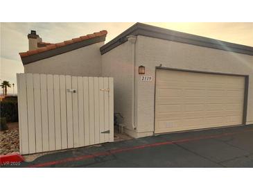 Attached garage with gated access and designated parking space at 2119 Pebble Creek Ln, Laughlin, NV 89029