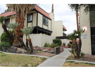 Exterior view of a two-story building with Spanish-style architecture and landscaping at 1420 Vegas Valley Dr # 23, Las Vegas, NV 89169