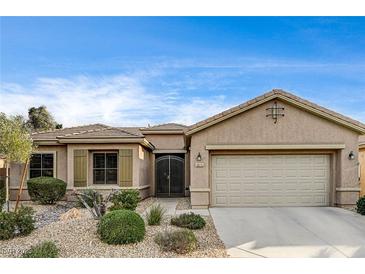 Charming single-story home with desert landscaping and a two-car garage at 5615 Criollo Dr, Las Vegas, NV 89122