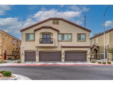 Two-story townhome with three-car garage and balcony at 7455 Snowy Owl St # 102, North Las Vegas, NV 89084