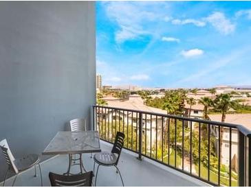 Relaxing balcony with seating offers stunning city views and blue skies above on a clear day at 211 E Flamingo Rd # 412, Las Vegas, NV 89169