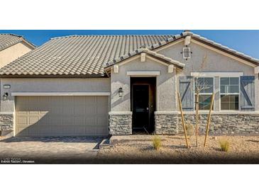 Single-story home with a neutral color scheme and stone accents at 340 Talladega Ct # Lot 13, Henderson, NV 89015