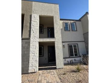 Modern two-story townhome with a private balcony and walkway at 353 Ukelele Pl # Lot 149, Henderson, NV 89015