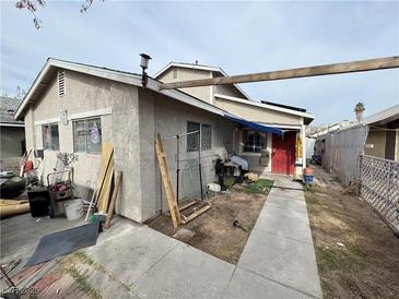 Home's exterior features a driveway and a fenced yard at 3620 Park Oliver Dr, Las Vegas, NV 89110