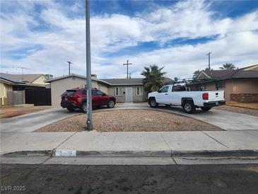 Ranch-style home with a spacious driveway and well-maintained landscaping at 2109 Juana Vista St, Las Vegas, NV 89102