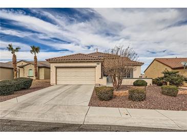 Single-story home with a two-car garage and desert landscaping at 2608 Dearport Ct, Henderson, NV 89052